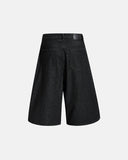Wide-leg raw denim shorts with off-center button closure