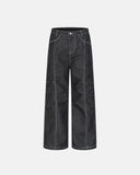 deconstructed pleated straight-leg jeans with structured seams and clean modern silhouette