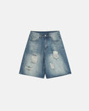 Distressed washed knee-length jorts front view