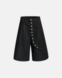 Asymmetric button raw denim jorts front view