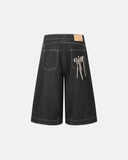 Vintage washed long denim shorts with curved panels