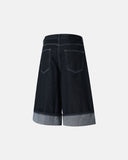 Wide-leg raw denim shorts with cuffed hem